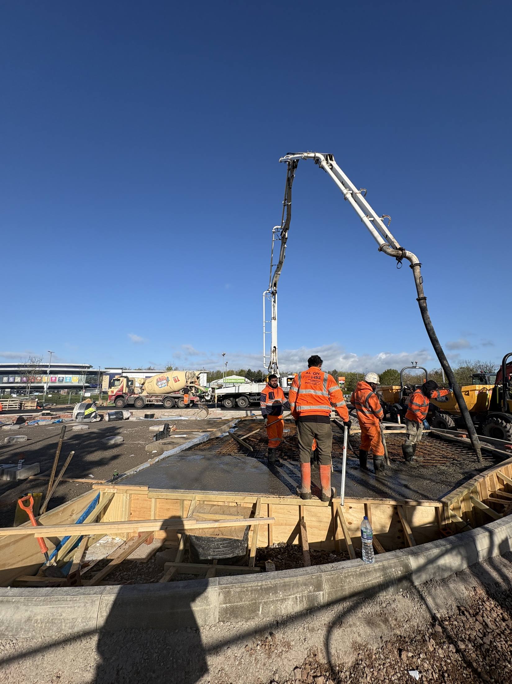 Concrete pour with crew on a large commercial slab