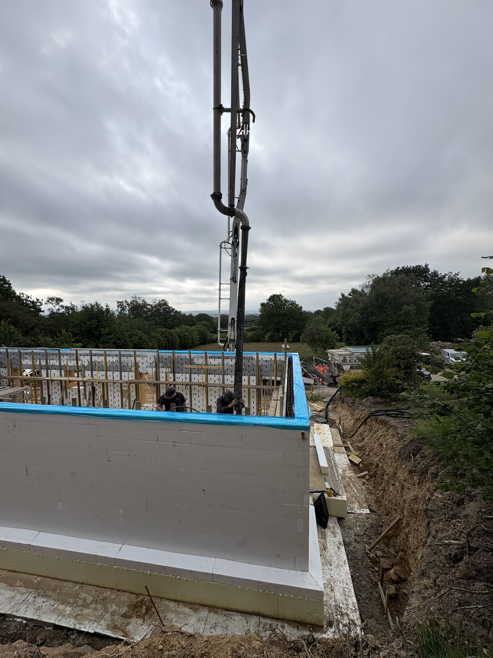 Line pump filling an ICF basement wall on a Shropshire build