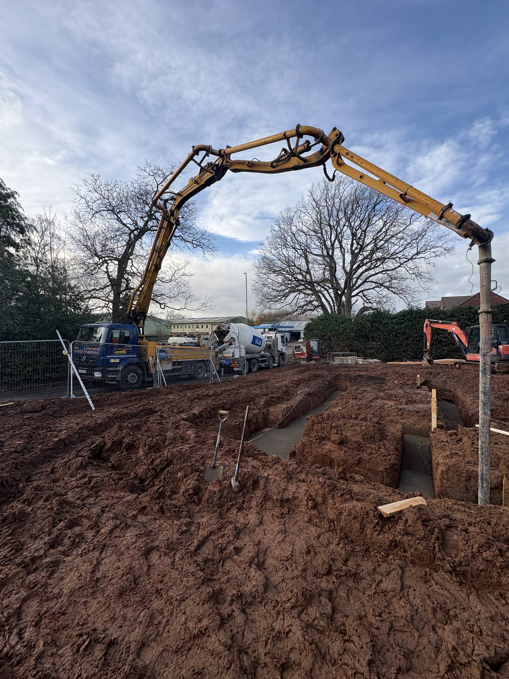 Older S. Wilkes Concrete Pumping rig on a farm building job