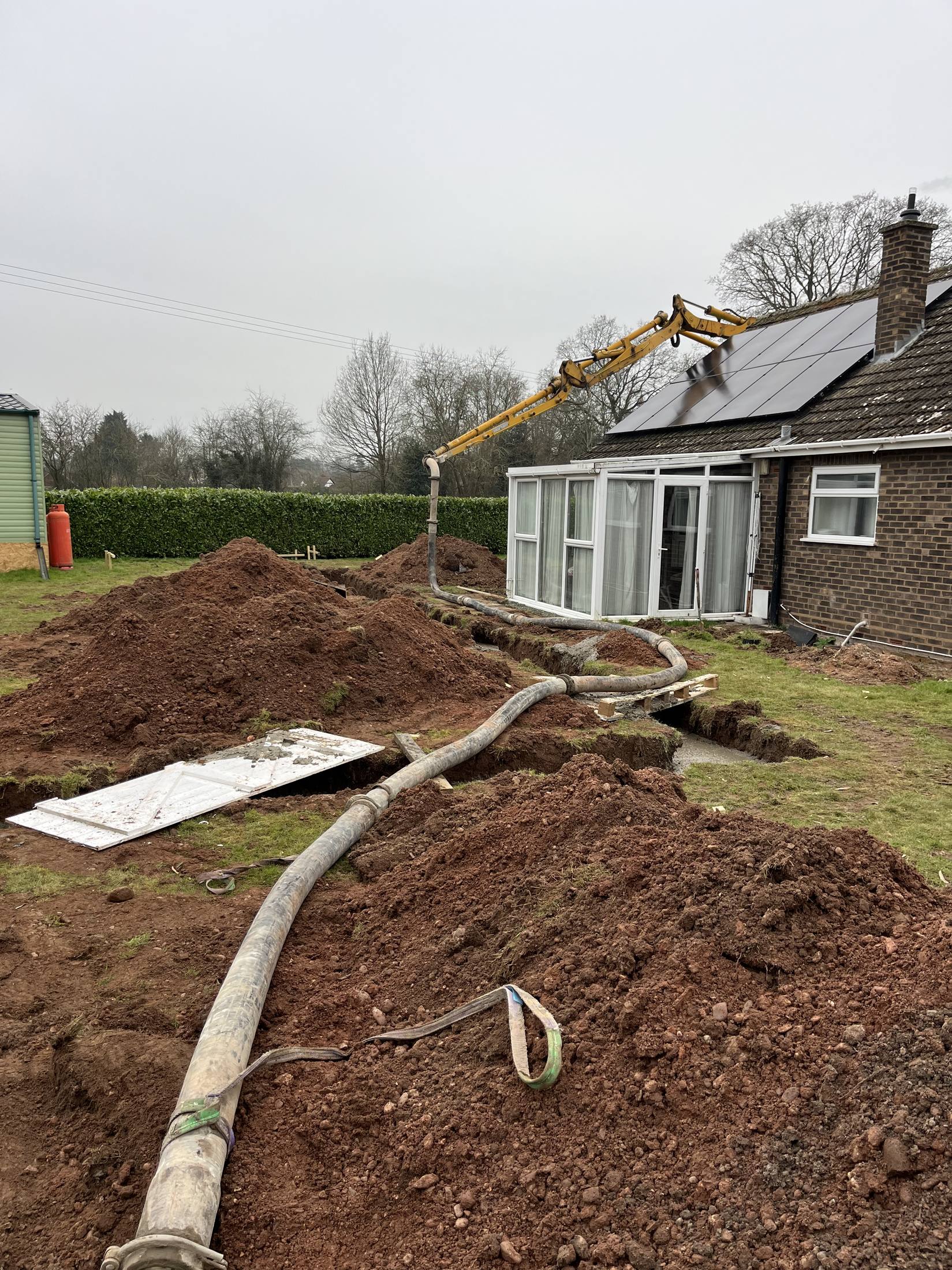 Line pumping run across a garden to a bungalow extension