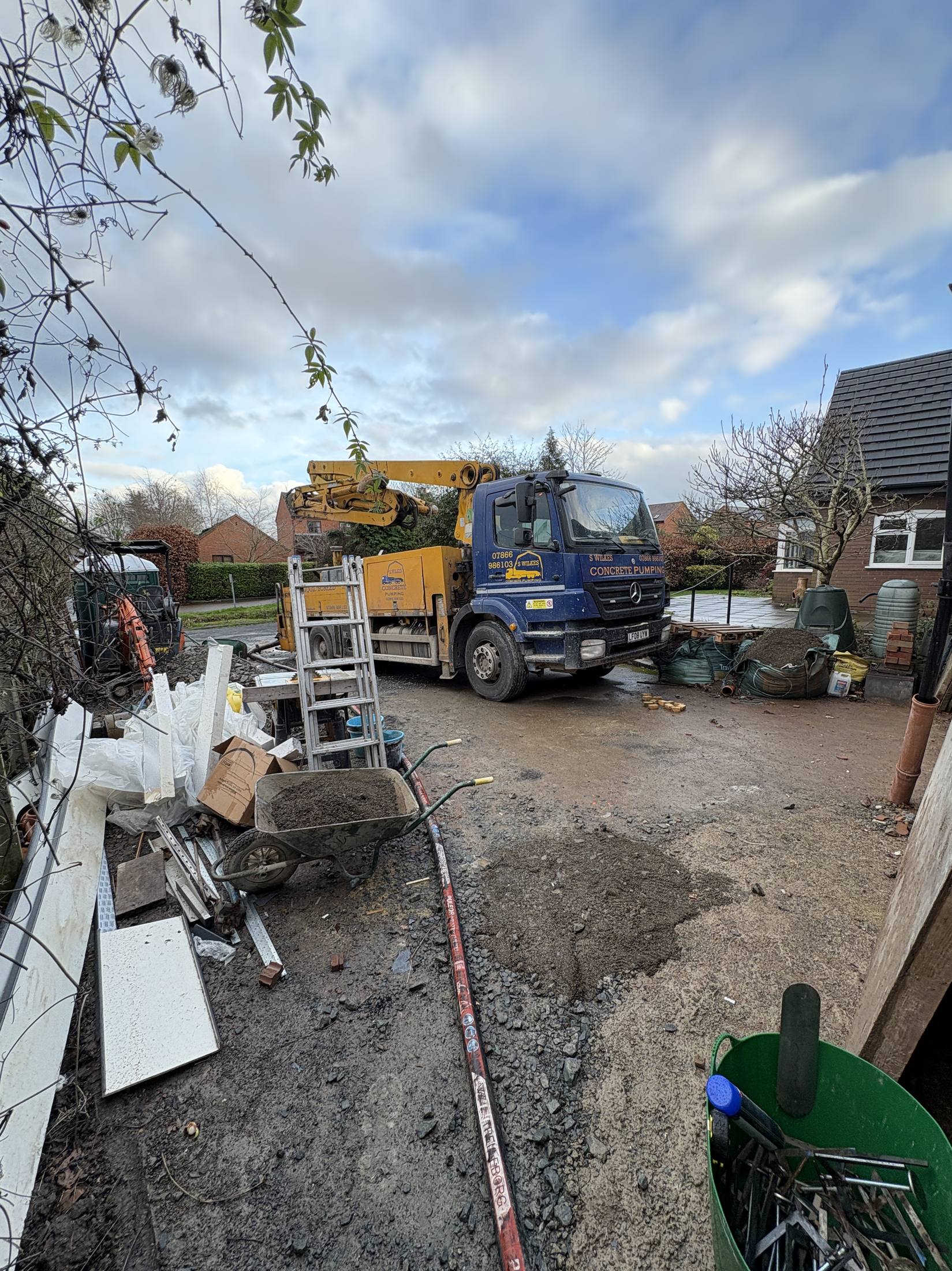 S. Wilkes liquid screed pump lorry on a residential driveway